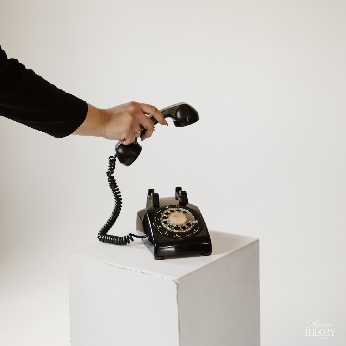 Social Media Management for Businesses in houston - a vintage black rotary phone bloom theory marketing photoshoot